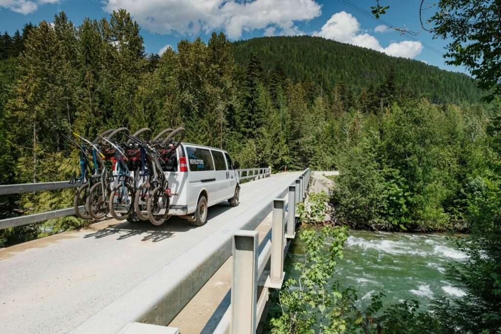 Revelstoke Transfers Mountain Bike Shuttle driving bikers to the trailhead