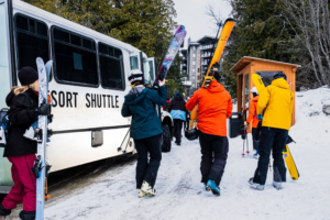 Revelstoke Transfers Resort Shuttle taking skiers between downtown and Revelstoke Mountain Resort