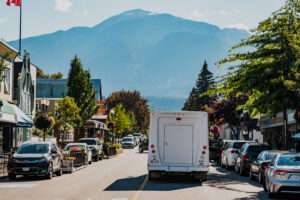 Revelstoke Transfers bus shuttling passengers around downtown Revelstoke in summer