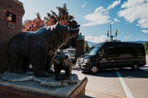 Revelstoke Transfers Van shuttling passengers around downtown Revelstoke in summer