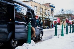 Revelstoke Transfers Van driving passengers around Revelstoke and other destinations in winter